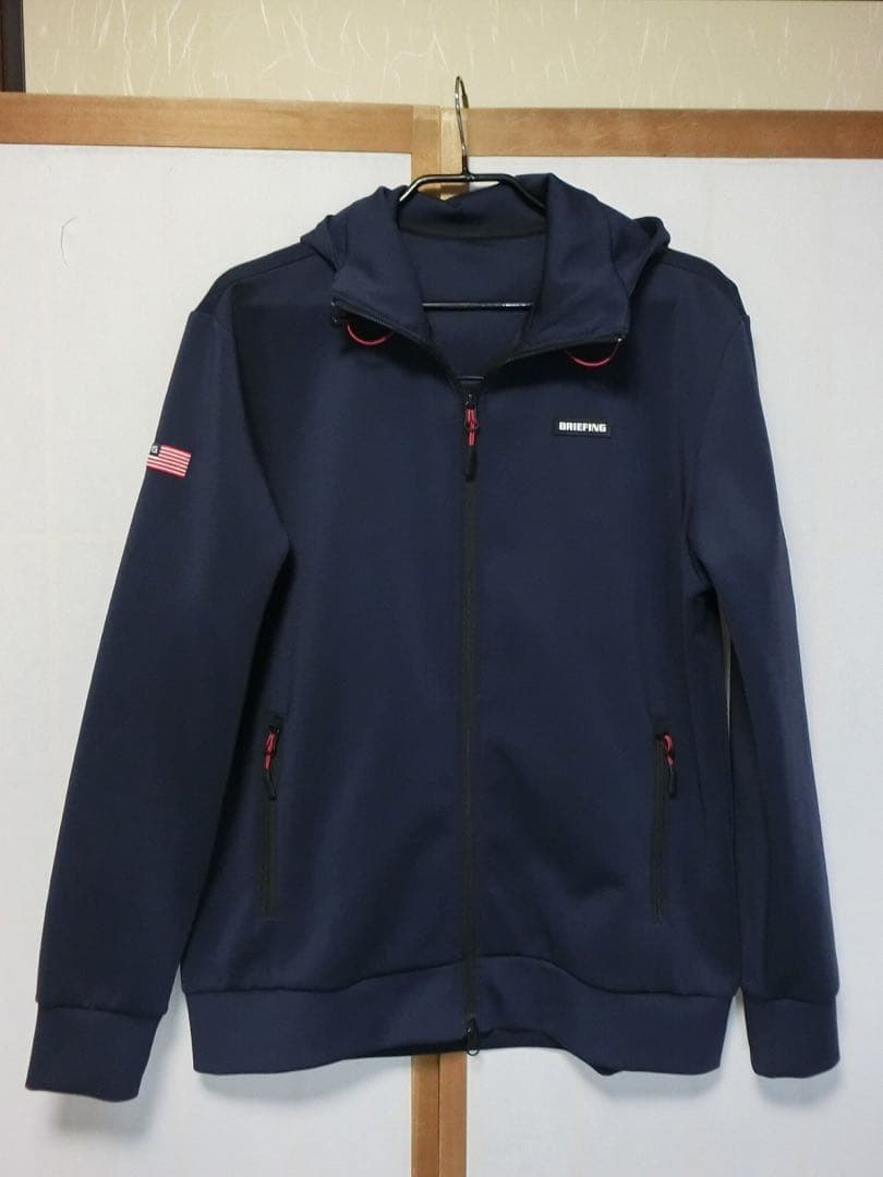 BRIEFING ブリーフィング　紺でバックに3Dロゴが付いた前開きパーカー L