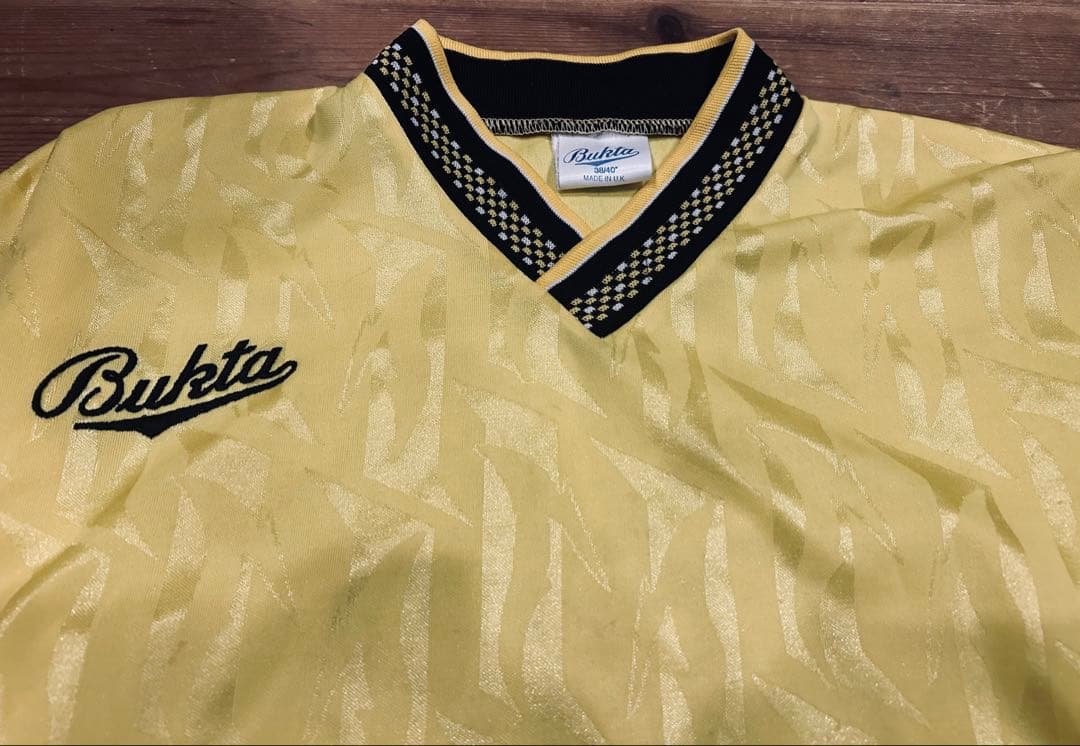ユニフォーム 古着 90s Bukta バクタ UK製 黄色 Vネック 40