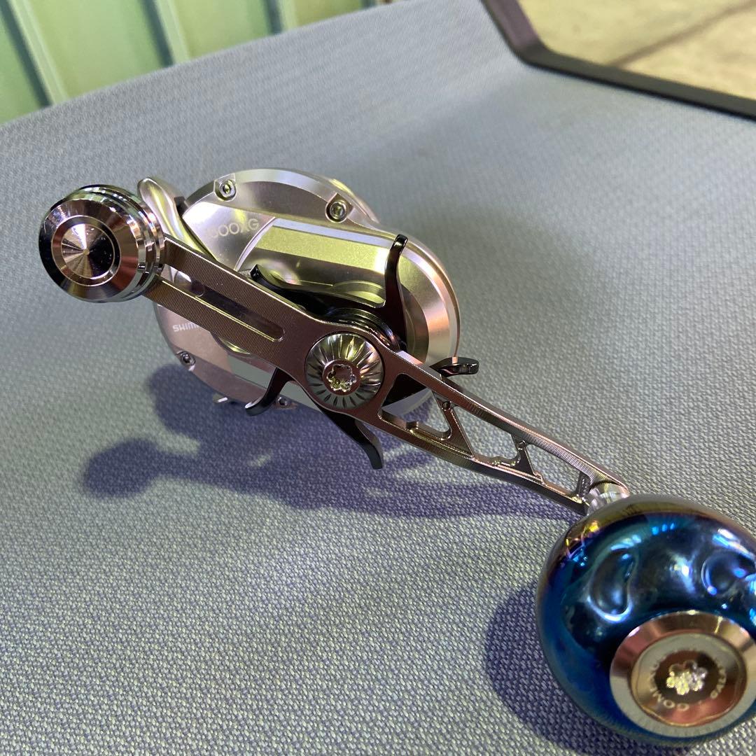 オシア ジガー ベイトリール マルチカラーライン付きゴメクサスハンドル付き