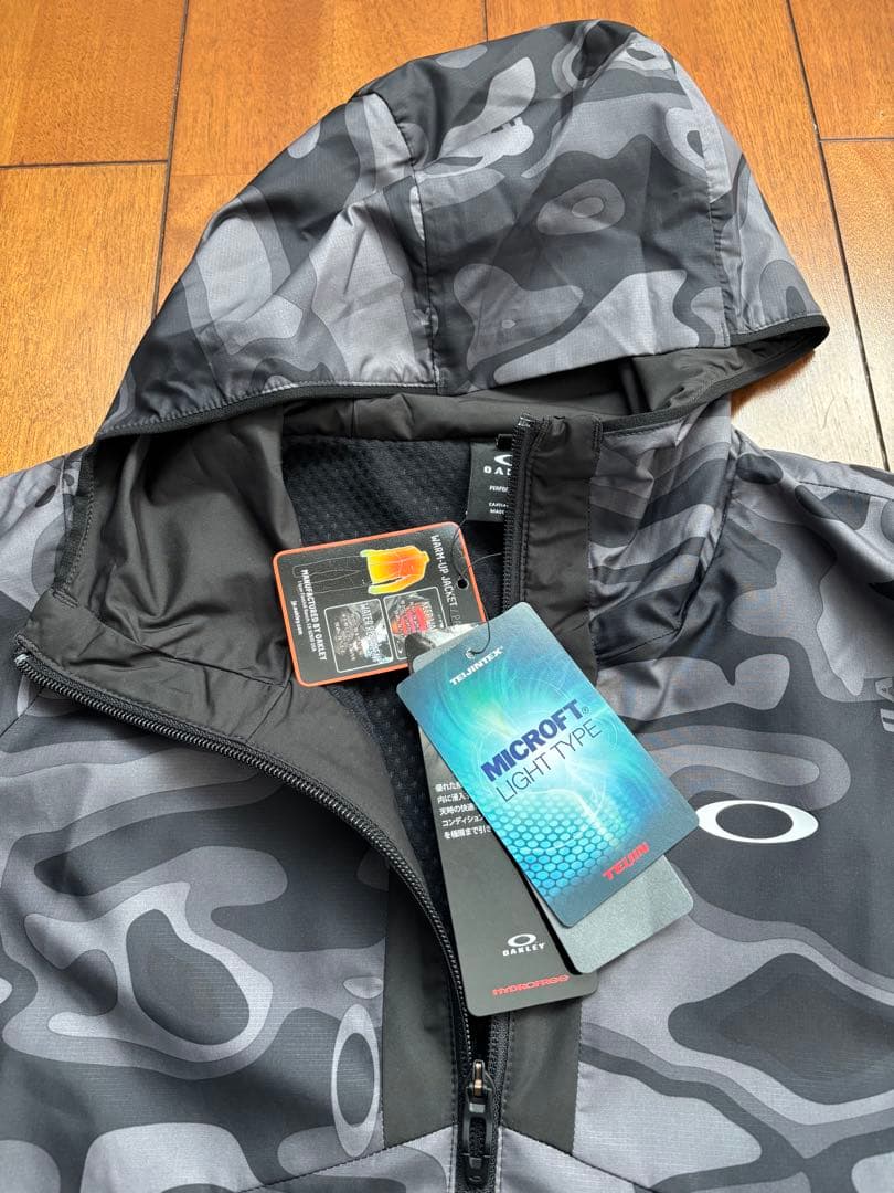 【新品未タグ付】オークリー ウインドブレーカー（上L・下M）保温 撥水 静音機能