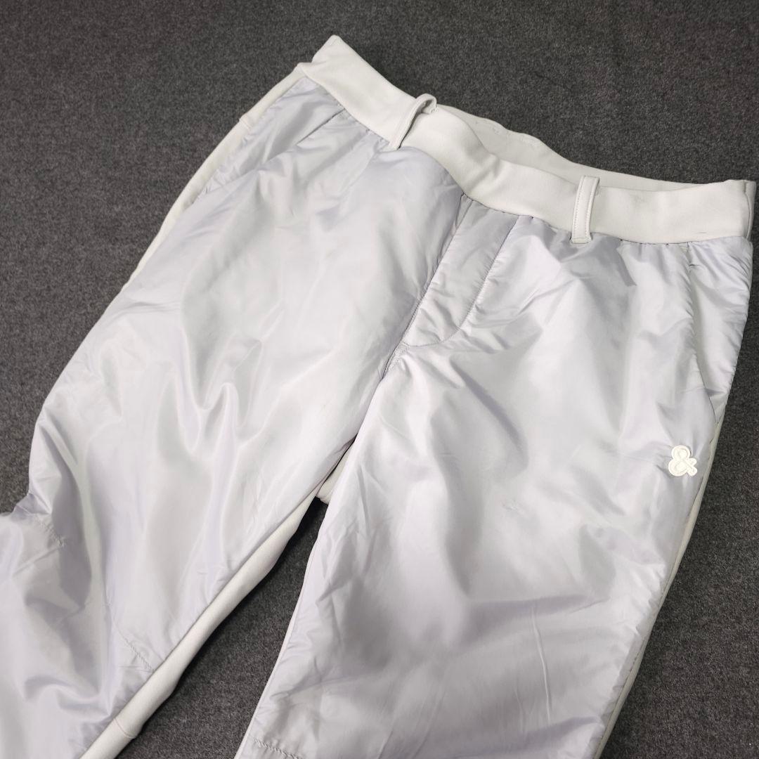 美品 アンパスィ ダンボールニット 中綿ストレッチゴルフパンツ LL