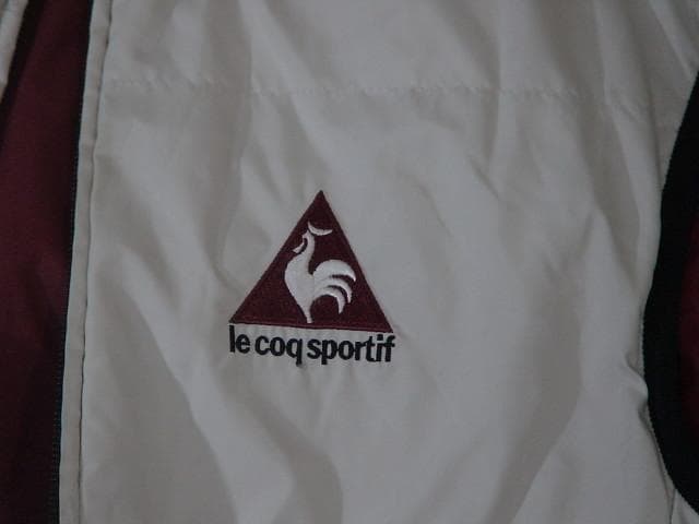 60951　ルコック　ゴルフ用リバーシブルベスト　白×ワインレッド　M