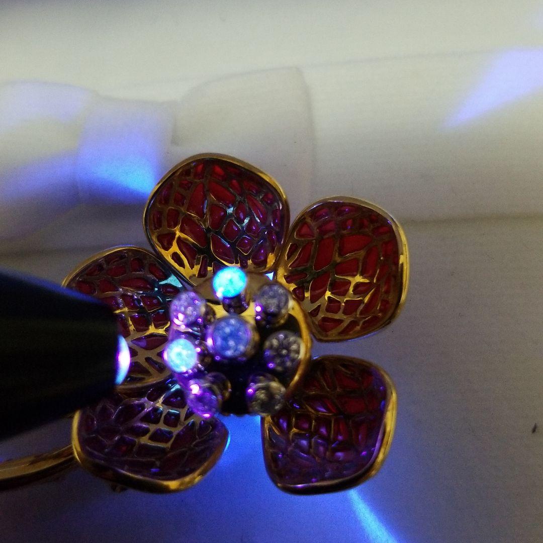 平和堂貿易　動く　ブローチ　刻印　あり　金　750　PT950　0、28カラット