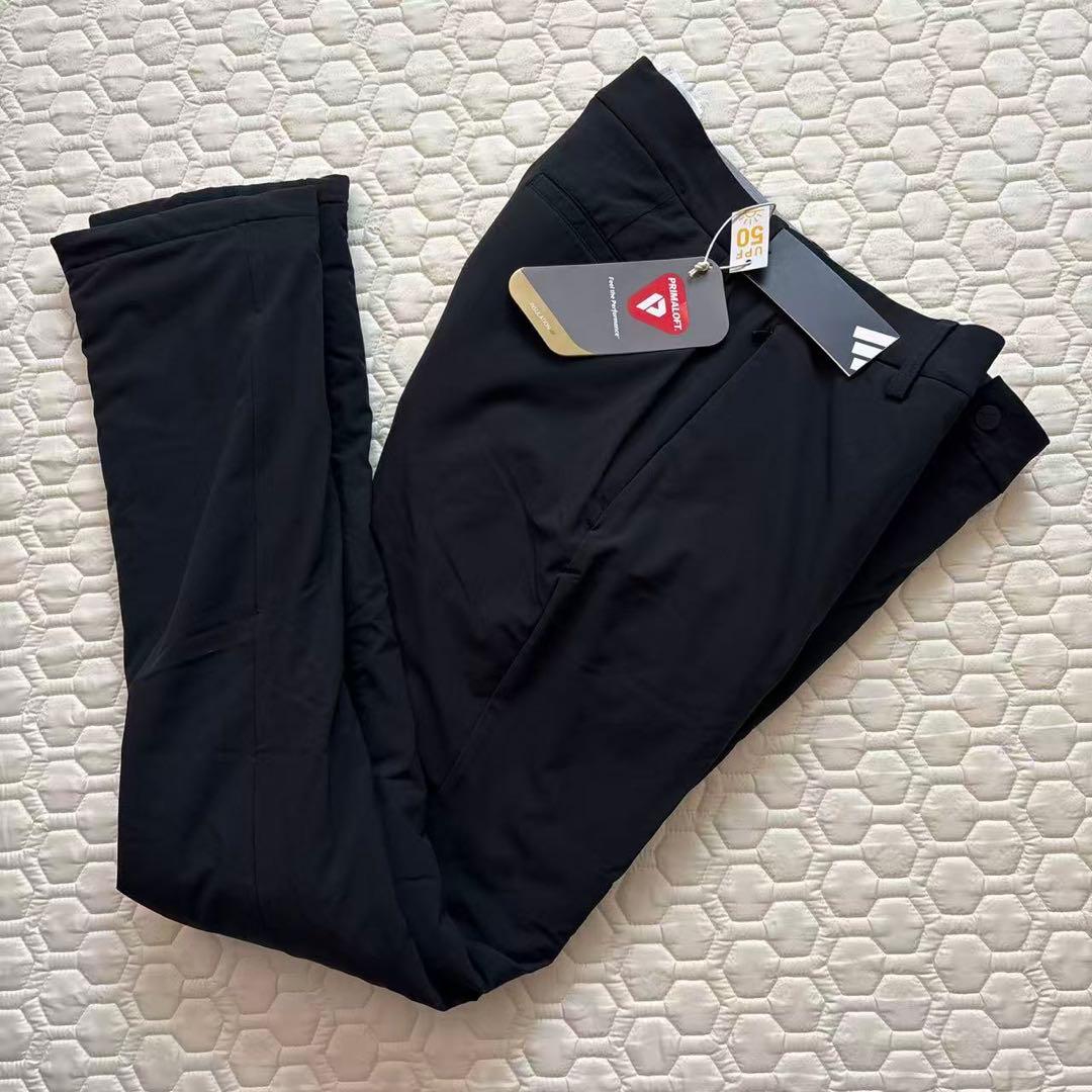 85新品27500円アディダスゴルフ/メンズ/秋冬/中綿ストレッチパンツ/黒