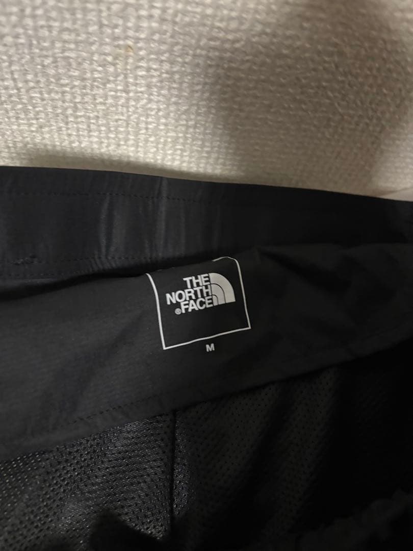 ザノースフェイス・ランニングダウンウェアNY82495レッドランロングパンツ黒Ｍ