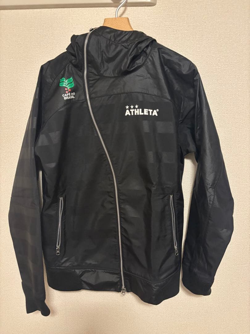 ATHLETA ブラック ピステ ウィンドブレーカー