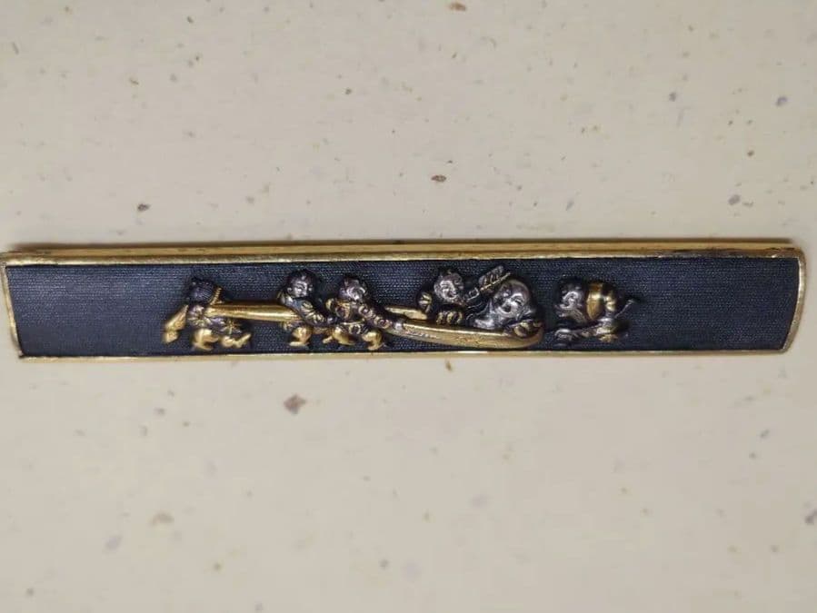 小柄袋、赤銅地に大黒引き唐子図