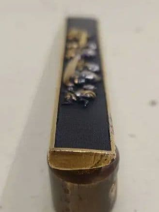 小柄袋、赤銅地に大黒引き唐子図