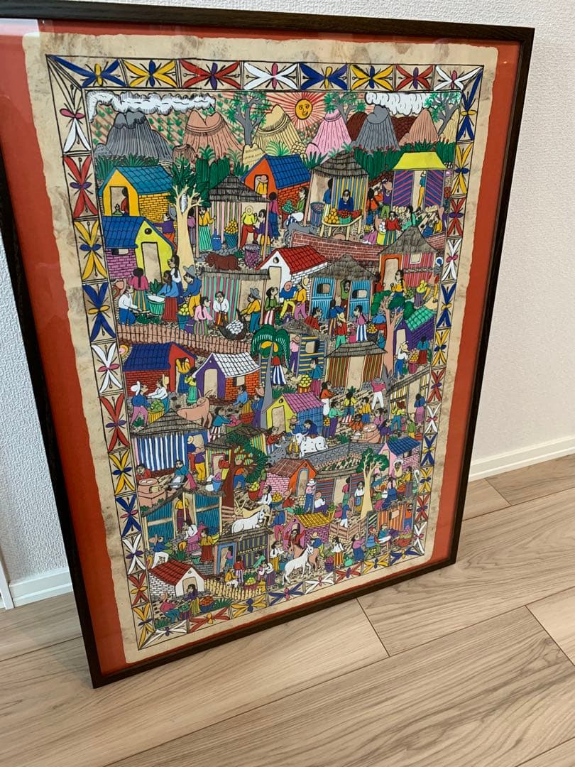 メキシコの村落　カラフルな民俗画