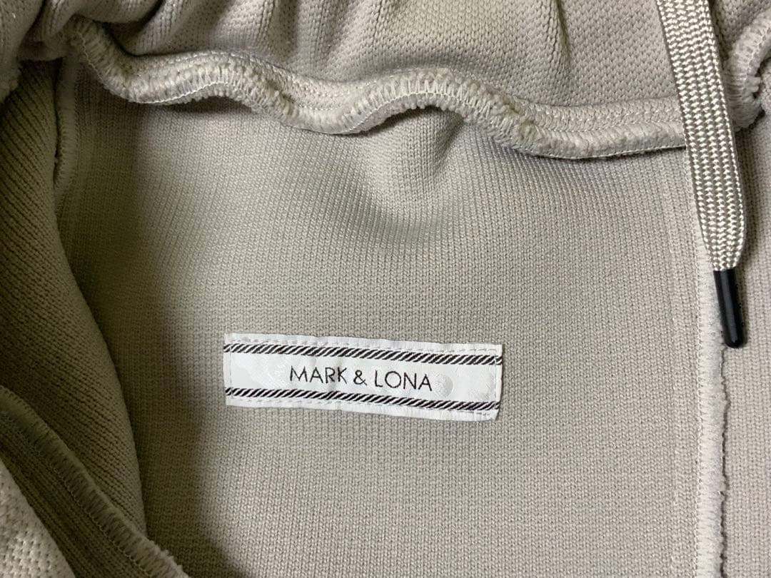 マークアンドロナレディースパンツ オレンジジッパー