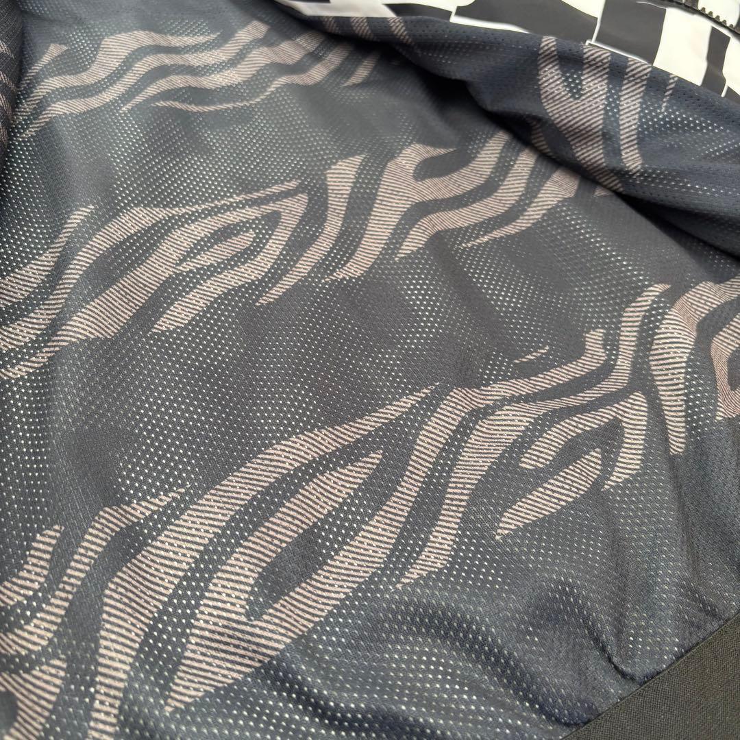 New Balance Golf 撥水防寒 フーディジャケット 総柄