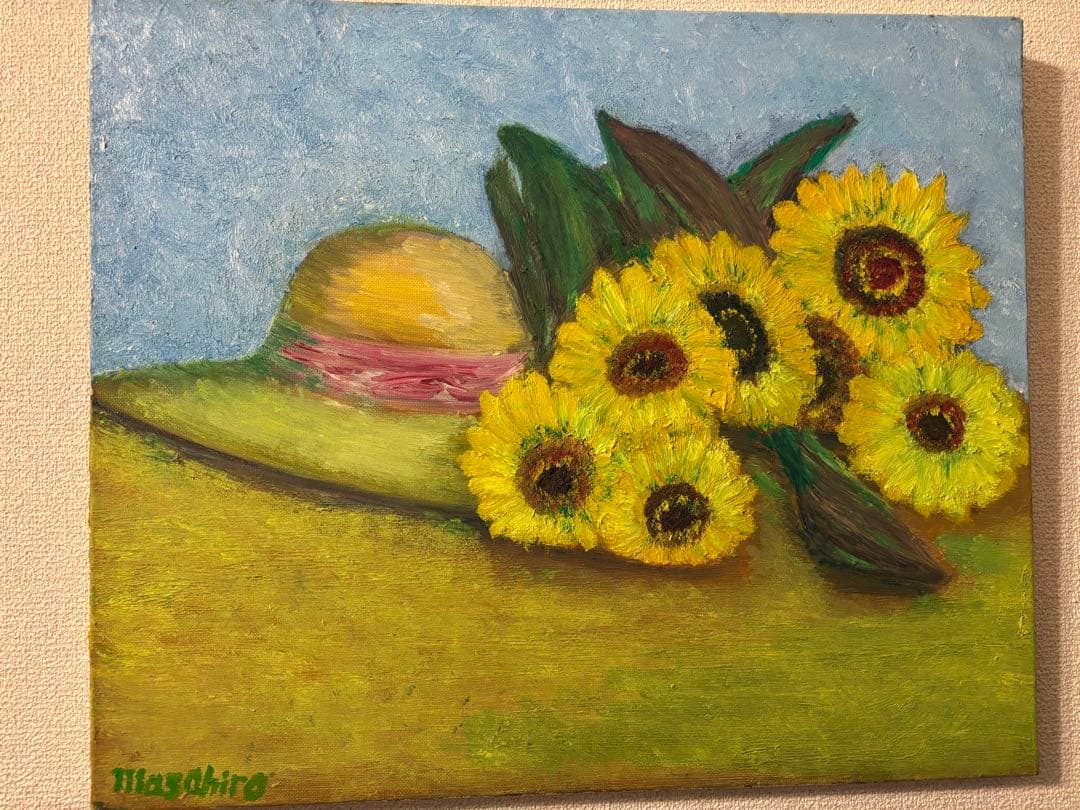 ひまわりと麦わら帽子