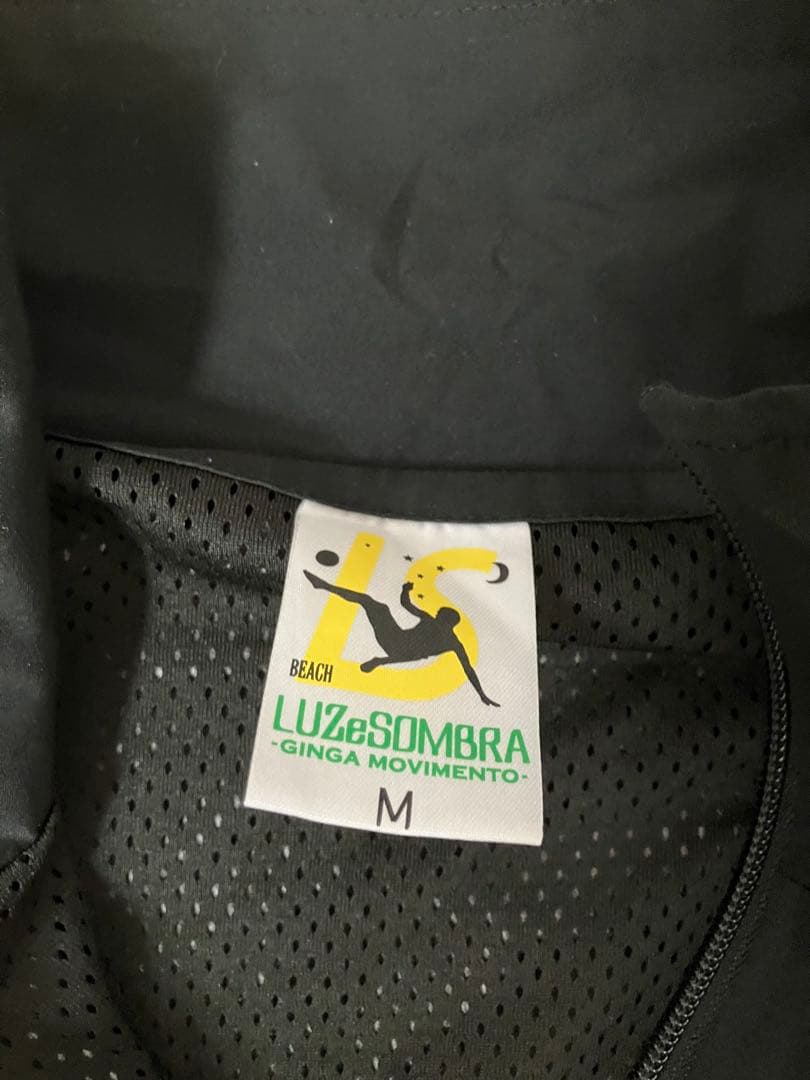 LUZ e SOMBRA ピステ・ウィンドブレーカー M
