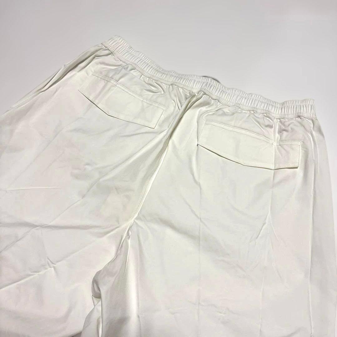 タグ付き未使用　xxio ゴルフ用レインウェア ホワイト ロゴ入　サイズXL