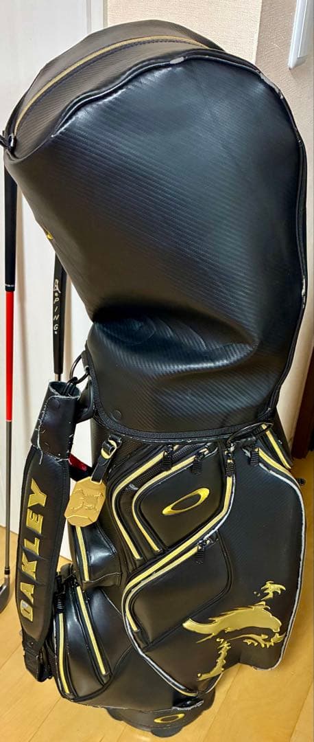 あきまる　OAKLEY ゴルフバッグ ブラック/イエロー　あ