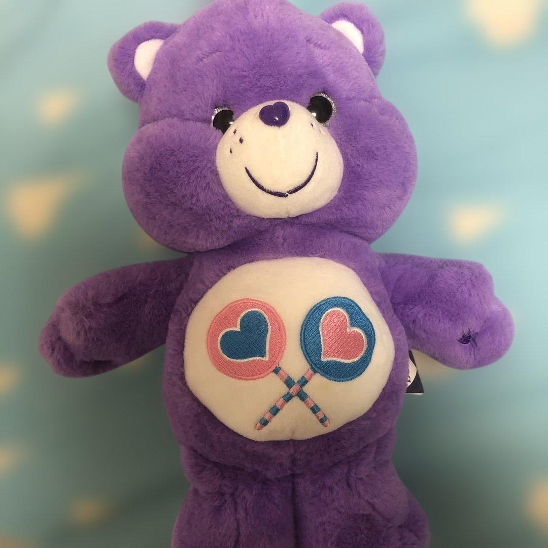 紫色のケアベアぬいぐるみ