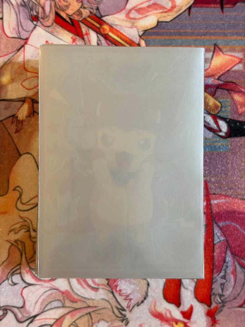 メガリザードンXのポンチョを着たピカチュウ　スリーブ