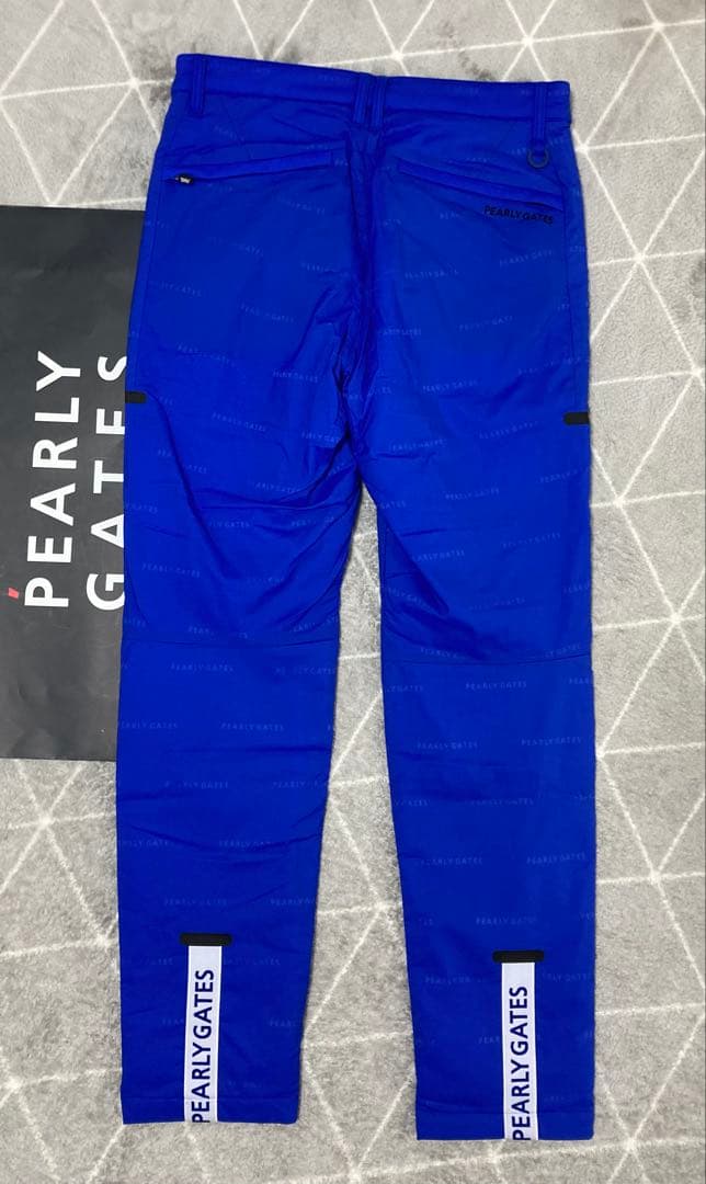 新品 パーリーゲイツ ナイロンストレッチロゴジャガード パンツ(5)サイズL/青