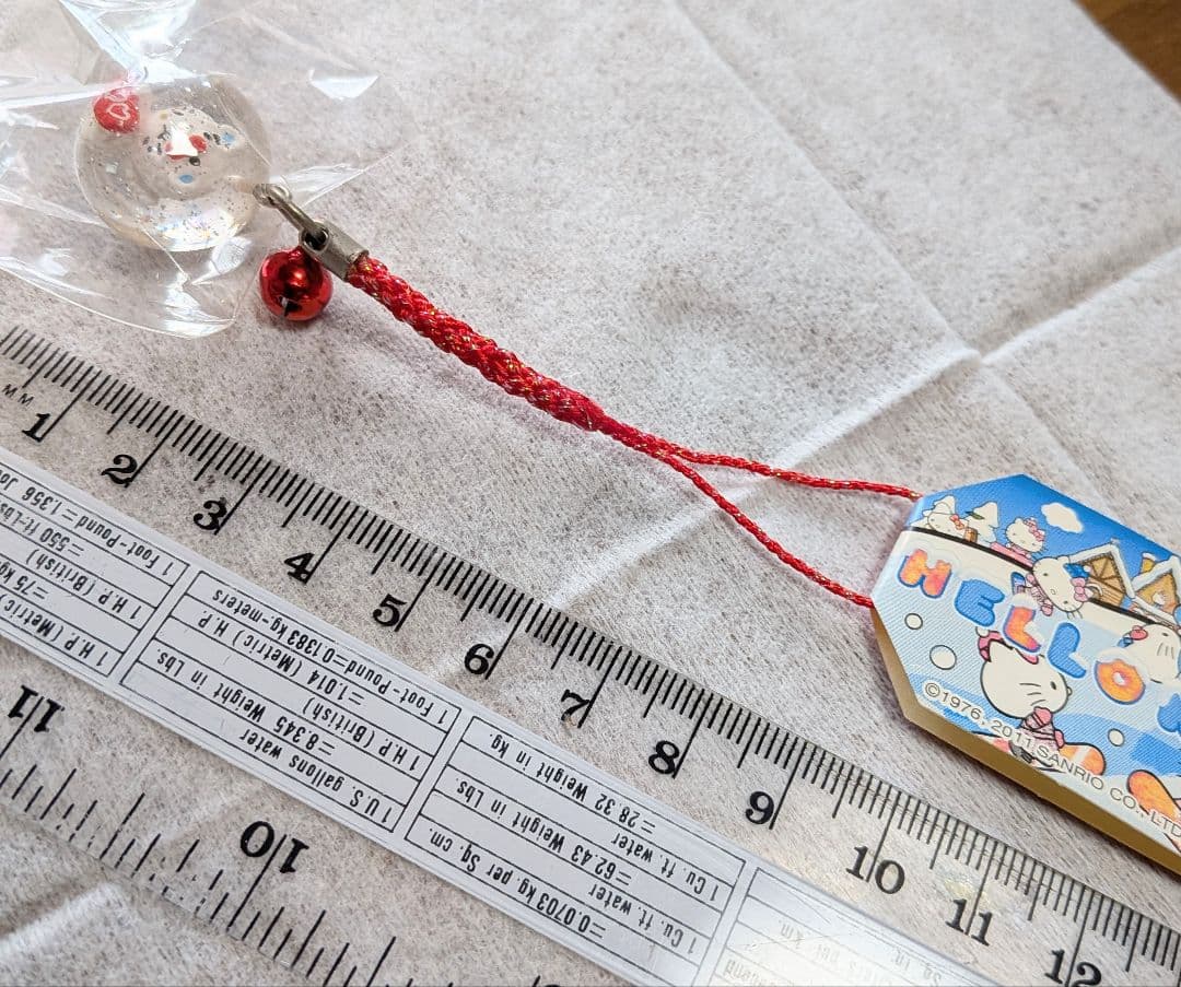 サンリオハローキティ根付ストラップスノーパラダイスラメ入丸玉白くまスノボVer.