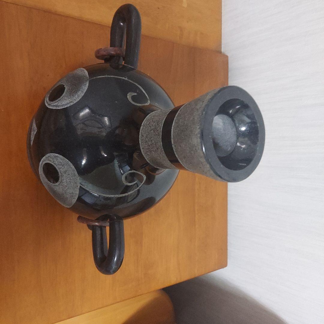 顔の形の黒色石製品置物25㎝