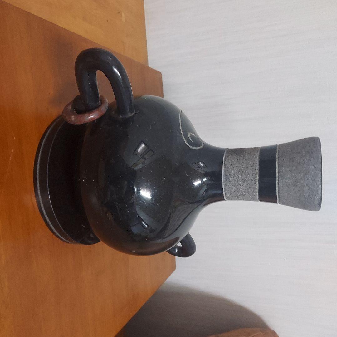 顔の形の黒色石製品置物25㎝