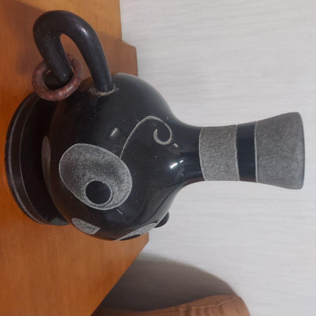 顔の形の黒色石製品置物25㎝