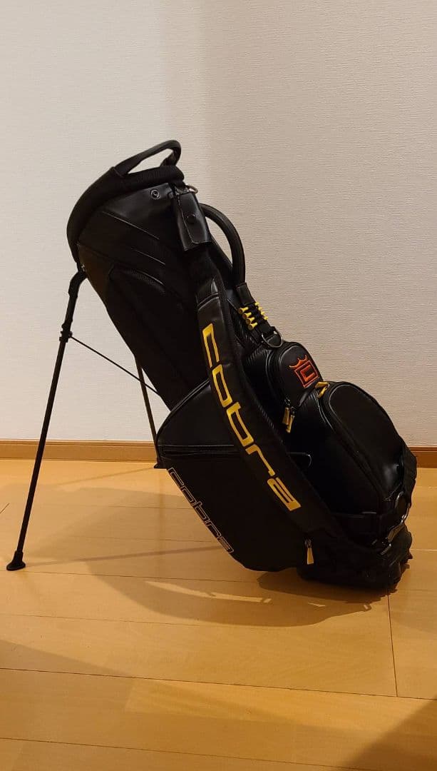 コブラ　ベゼルコラボスタンドバッグ 黒/黄色