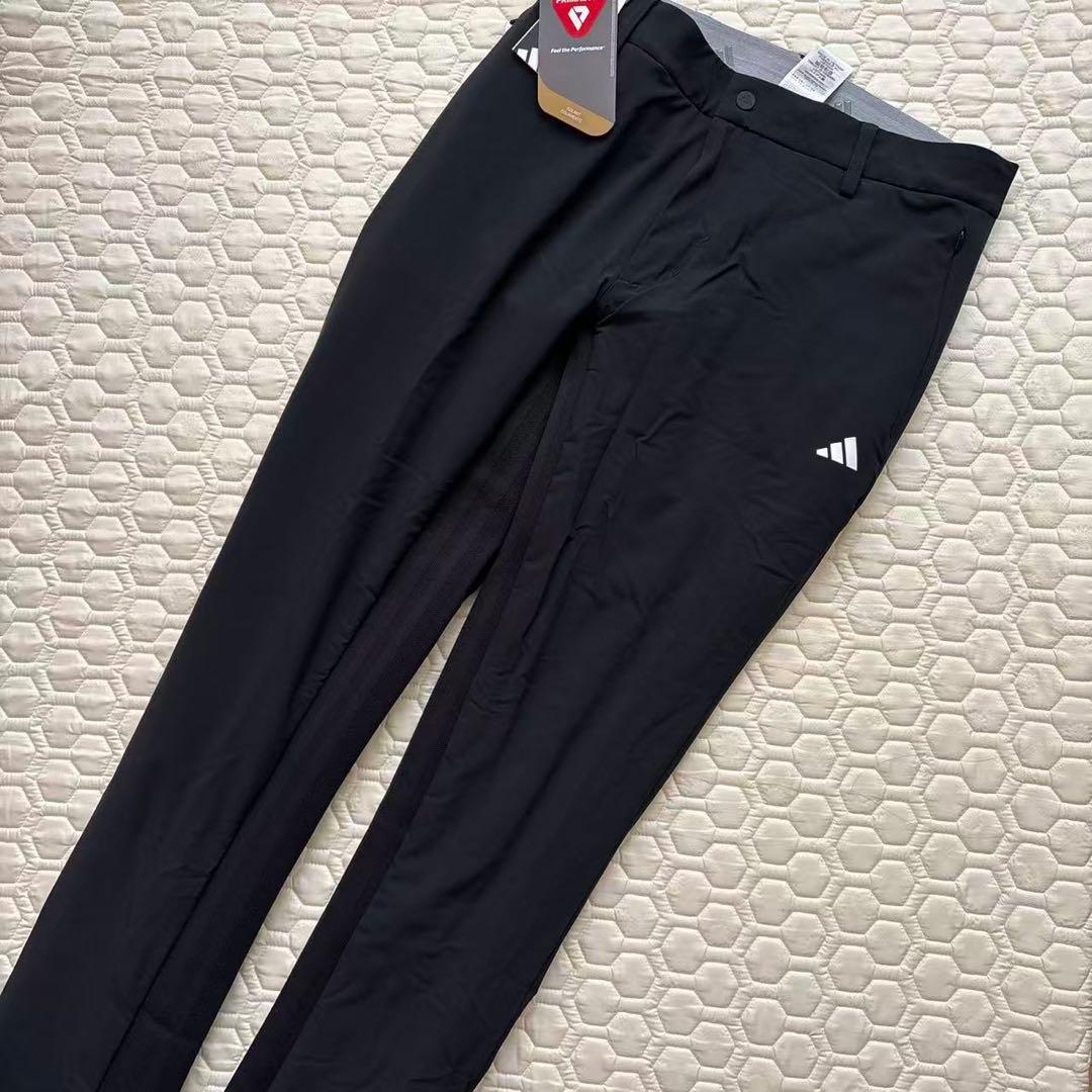 82新品27500円アディダスゴルフ/メンズ/秋冬/中綿ストレッチパンツ/黒